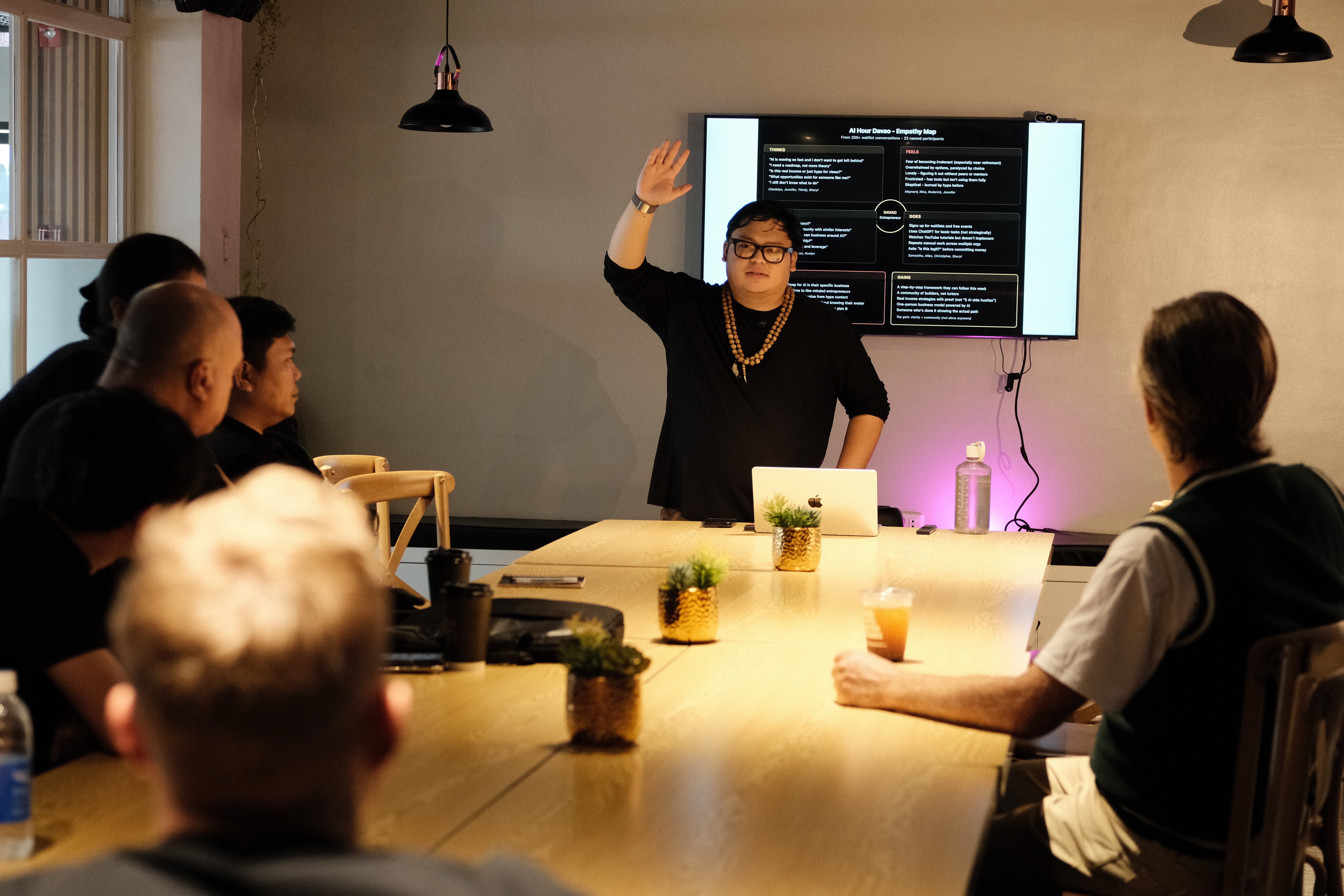 Cris Vinson running the AI Business Hour, a cafe full of founders building AI systems live