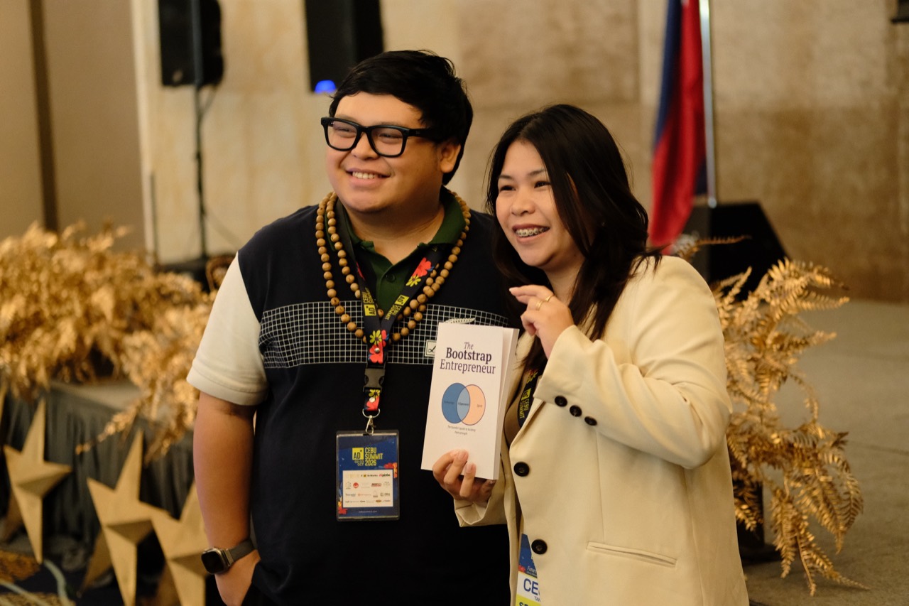 Cris and an attendee with The Bootstrap Entrepreneur at Cebu Summit