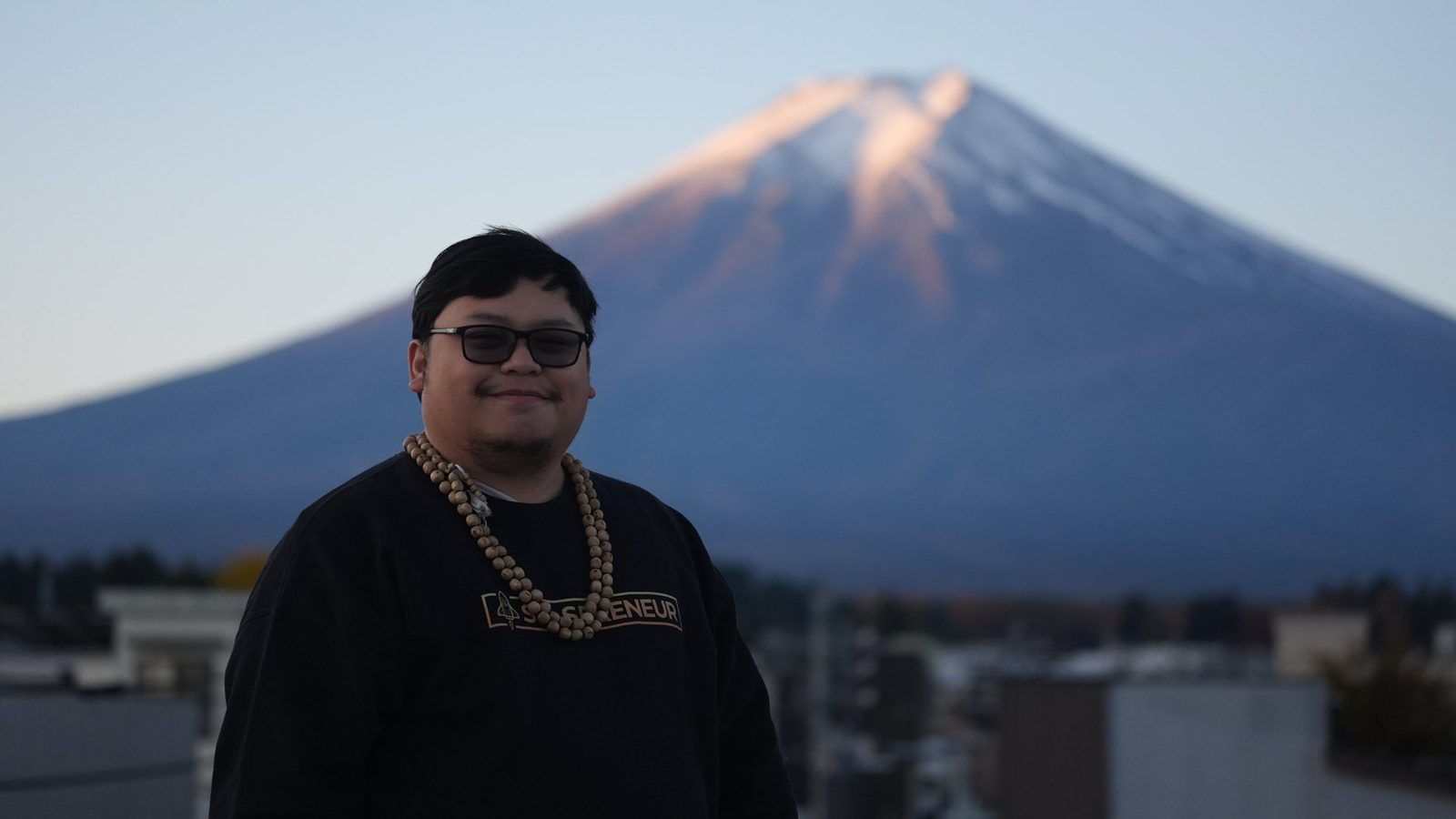 Cris Vinson standing before Mount Fuji
